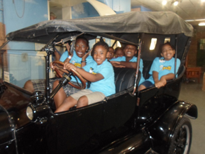 Childrens museum posing in car