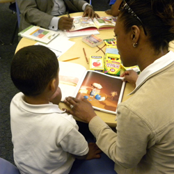 student and mentor sharing a book